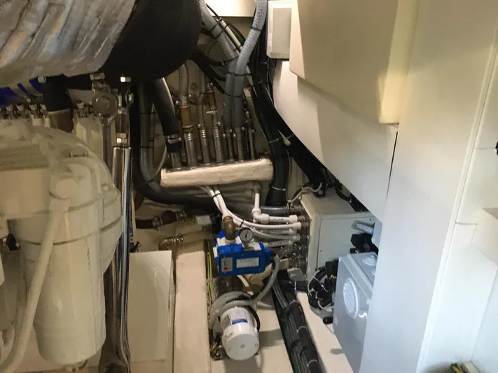  Yacht Photos Pics Engine room of 2018 Ferretti Yachts 670, showcasing complex mechanical systems and components.
