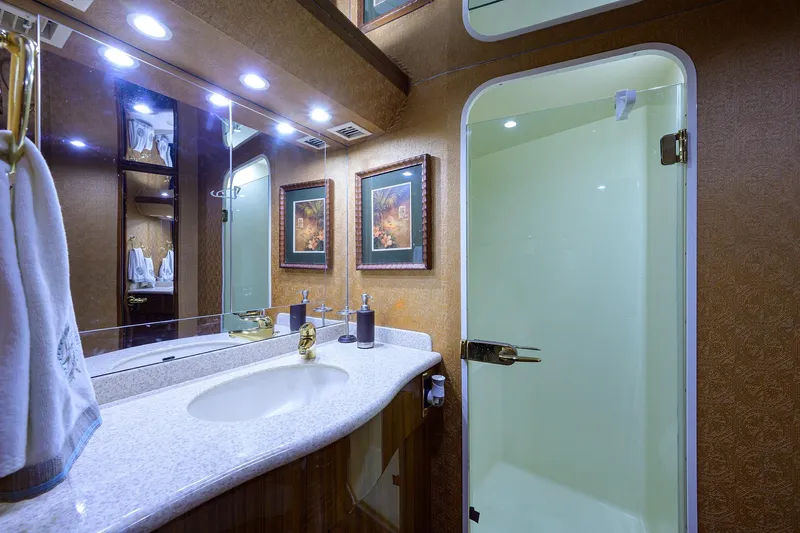 Yacht Photos Pics Luxurious bathroom in 2005 Viking 61 yacht with elegant fixtures and modern shower.