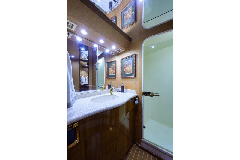  Yacht Photos Pics Luxurious bathroom in 2005 Viking 61 yacht with elegant fixtures and modern design.