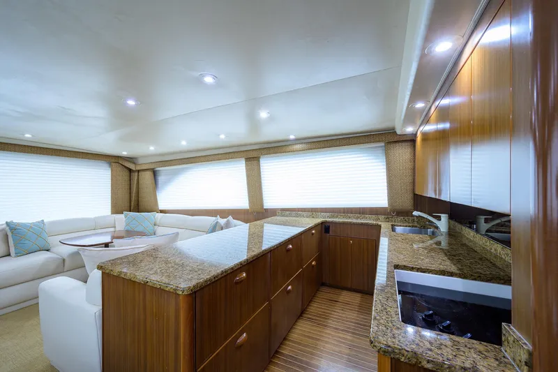  Yacht Photos Pics Luxurious interior of 2005 Viking 61 yacht with modern kitchen and seating area.
