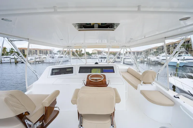  Yacht Photos Pics Luxurious 2005 Viking 61 yacht helm with modern navigation system and comfortable seating.