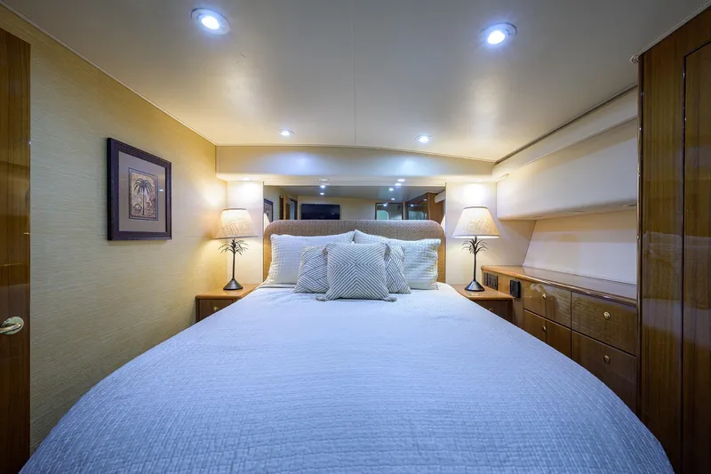  Yacht Photos Pics Luxurious bedroom interior of 2005 Viking 61 yacht with elegant lighting and decor.