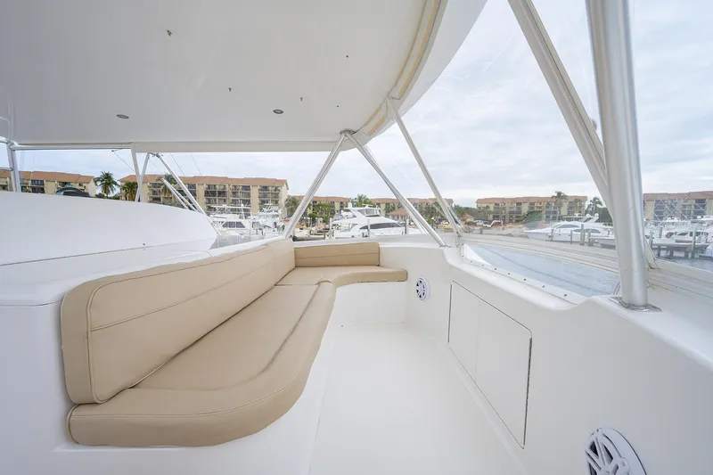  Yacht Photos Pics Spacious seating area on 2005 Viking 61 yacht, overlooking marina with modern amenities.