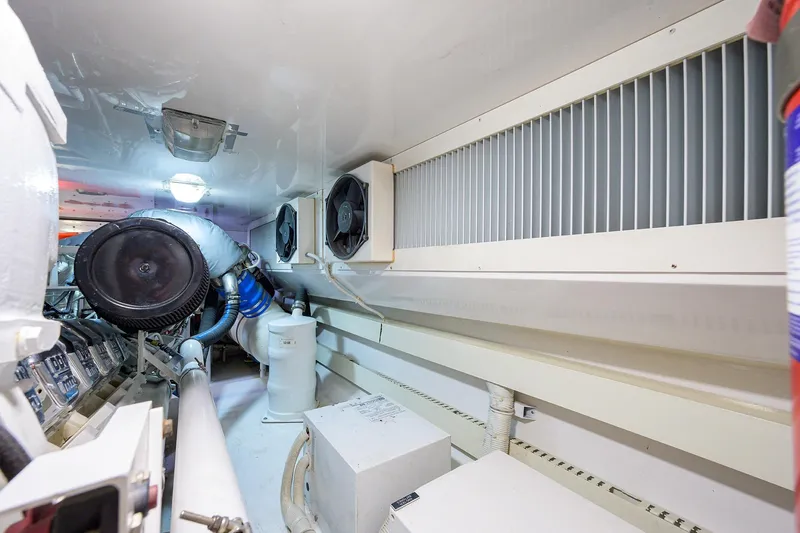  Yacht Photos Pics Engine room of a 2005 Viking 61 yacht, featuring ventilation and machinery components.