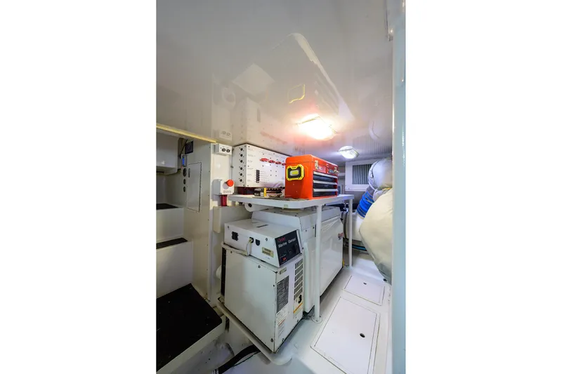  Yacht Photos Pics Engine room of 2005 Viking 61 yacht with equipment and tools.