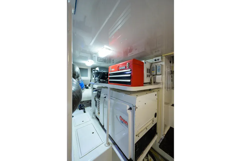  Yacht Photos Pics Engine room of 2005 Viking 61 yacht with tool chest and equipment.