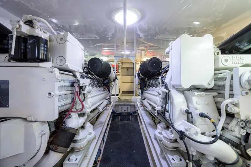  Yacht Photos Pics Engine room of a 2005 Viking 61 yacht, showcasing dual engines and mechanical components.