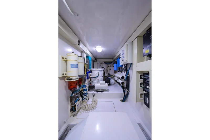  Yacht Photos Pics Engine room of 2005 Viking 61 yacht, showcasing mechanical systems and equipment.