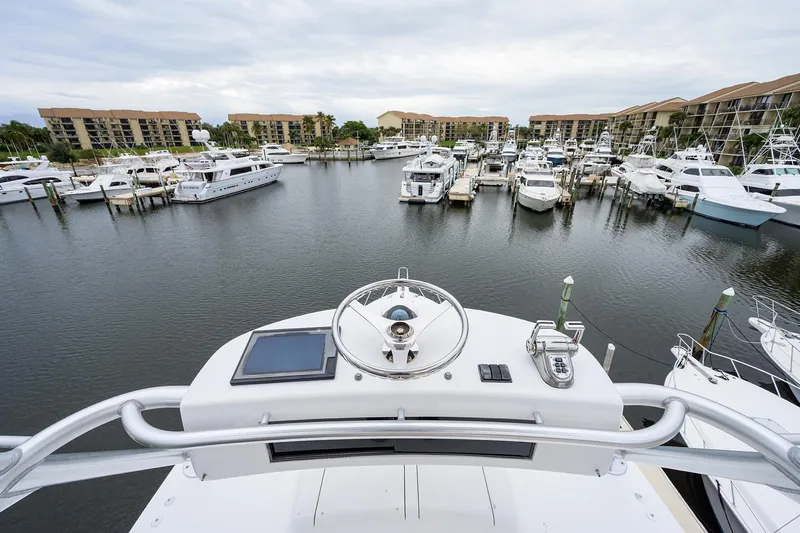  Yacht Photos Pics View from 2005 Viking 61 yacht helm overlooking marina with multiple boats docked.