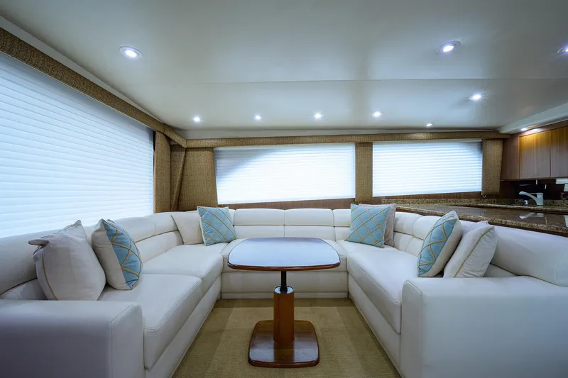  Yacht Photos Pics Luxurious interior of 2005 Viking 61 yacht with plush seating and elegant decor.