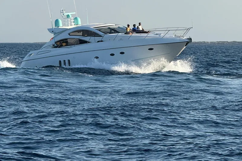Bes Yacht Photos Pics 2007 Sunseeker Predator 62 yacht cruising on open sea with passengers onboard.