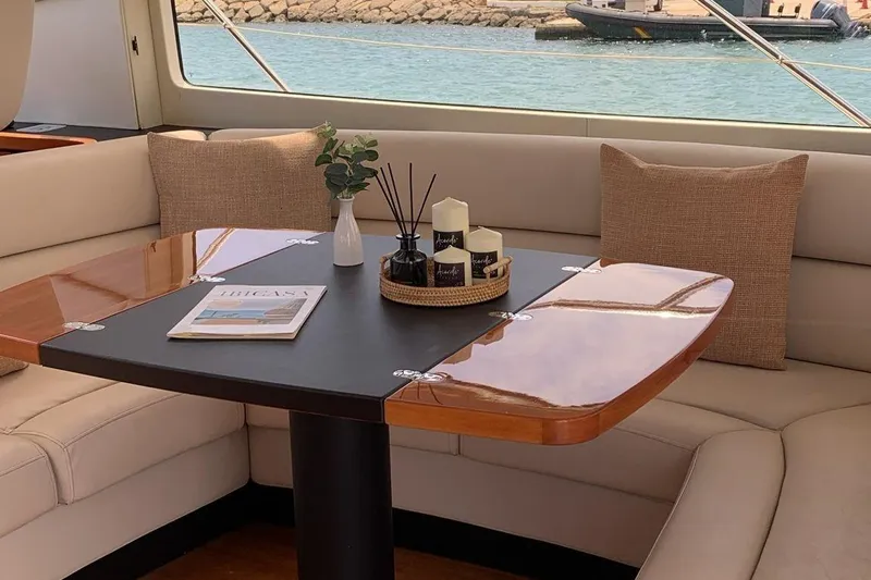 Bes Yacht Photos Pics Luxurious interior of 2007 Sunseeker Predator 62 yacht with elegant table and comfortable seating.