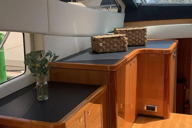 Bes Yacht Photos Pics Interior of 2007 Sunseeker Predator 62 yacht with wooden cabinetry and decorative elements.