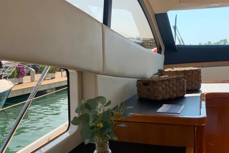 Bes Yacht Photos Pics Interior of 2007 Sunseeker Predator 62 yacht with wicker baskets and greenery.