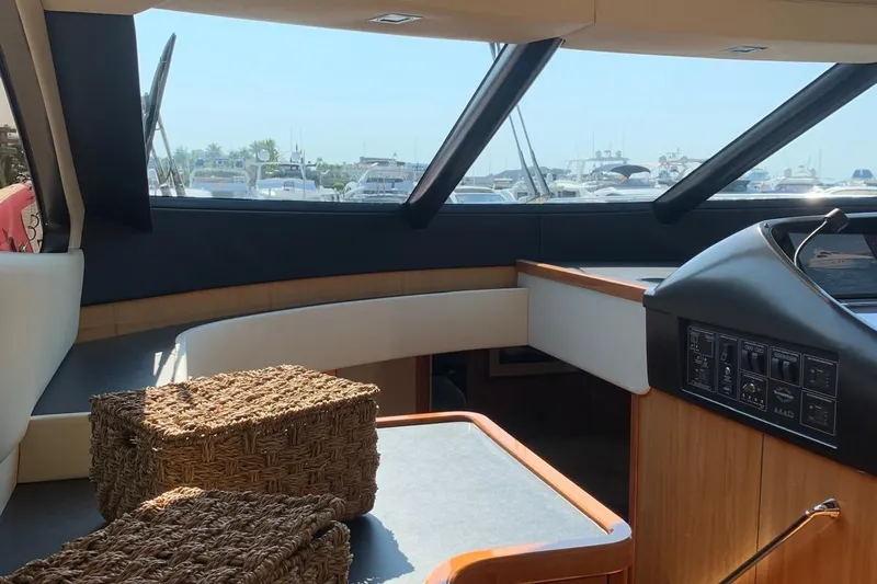 Bes Yacht Photos Pics Interior of 2007 Sunseeker Predator 62 yacht with wicker baskets and control panel.