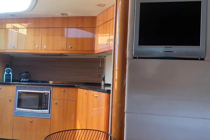 Bes Yacht Photos Pics Luxurious kitchen interior of 2007 Sunseeker Predator 62 yacht with modern appliances.