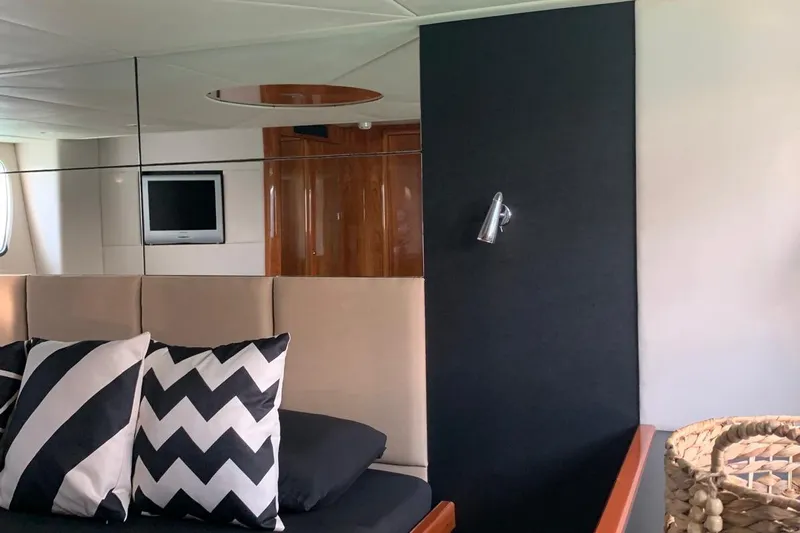 Bes Yacht Photos Pics Luxurious interior of 2007 Sunseeker Predator 62 yacht with modern decor and stylish cushions.