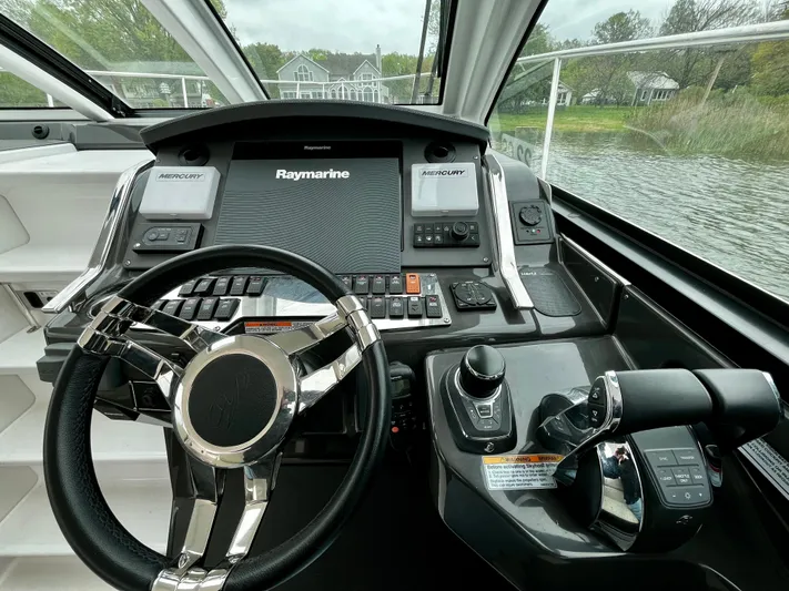 The Mabel Coe Yacht Photos Pics 2018 Monterey 360 Sport Coupe helm with Raymarine electronics and dual Mercury controls.