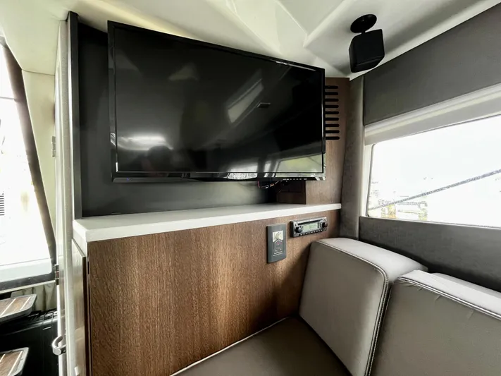 The Mabel Coe Yacht Photos Pics Interior of 2018 Monterey 360 Sport Coupe with mounted TV and seating area.