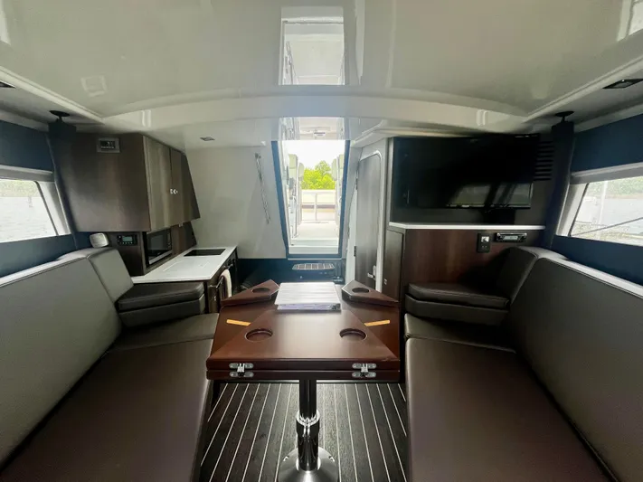 The Mabel Coe Yacht Photos Pics Interior of 2018 Monterey 360 Sport Coupe yacht with modern seating and entertainment area.