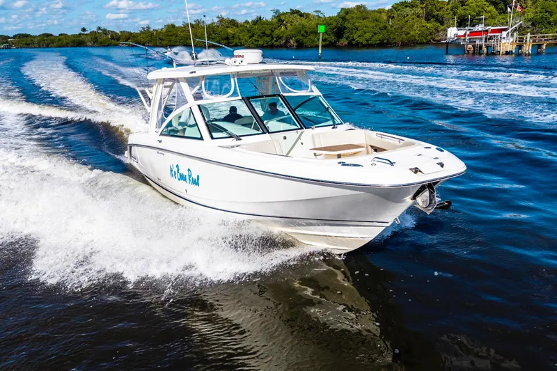 It's Been Reel Yacht Photos Pics 2019 Boston Whaler 320 Vantage cruising on a scenic waterway.