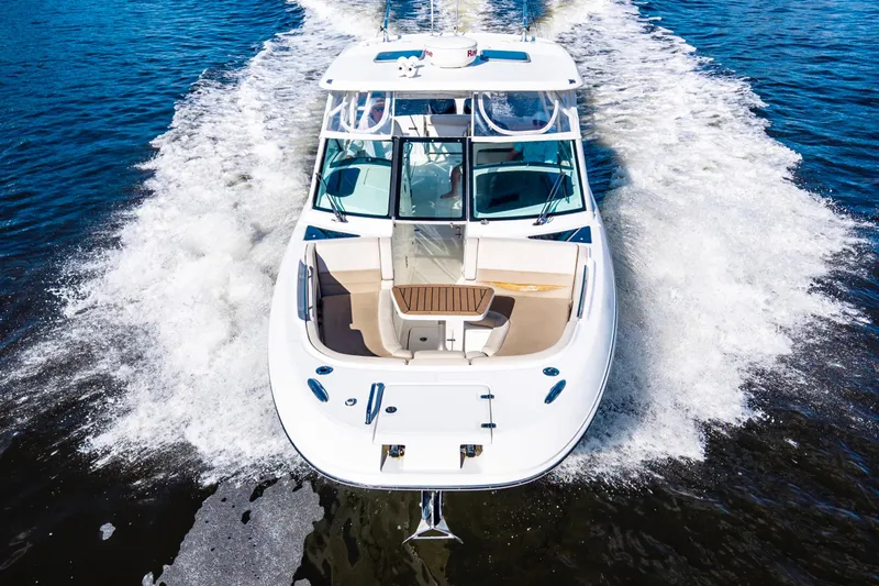 It's Been Reel Yacht Photos Pics 2019 Boston Whaler 320 Vantage cruising on open water, aerial view.
