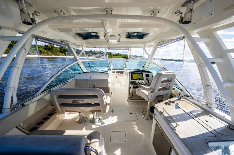 It's Been Reel Yacht Photos Pics Interior view of 2019 Boston Whaler 320 Vantage boat, featuring helm and seating area.