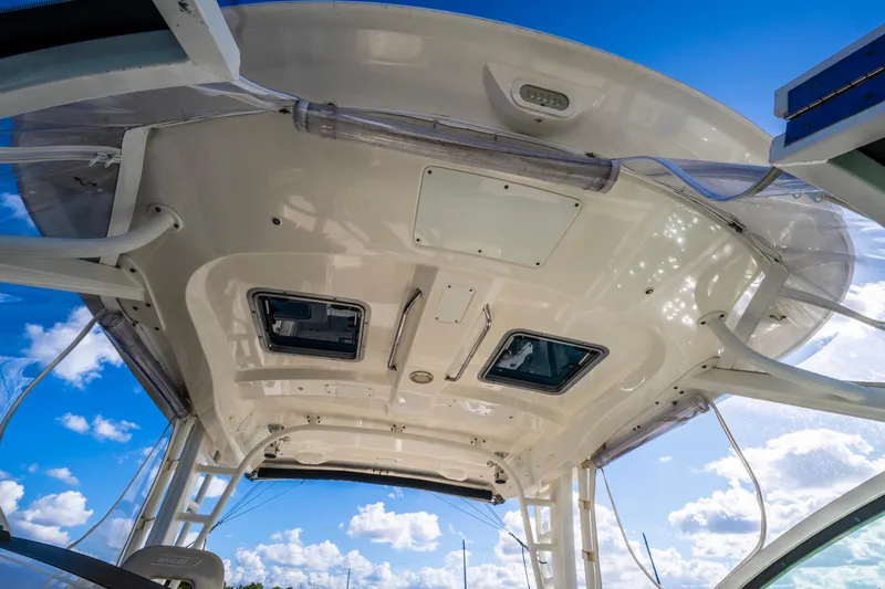It's Been Reel Yacht Photos Pics 2019 Boston Whaler 320 Vantage boat roof with clear sky background.