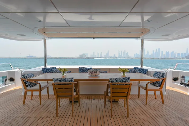  Yacht Photos Pics Luxurious 2026 Majesty 120 yacht deck with elegant seating and ocean view.