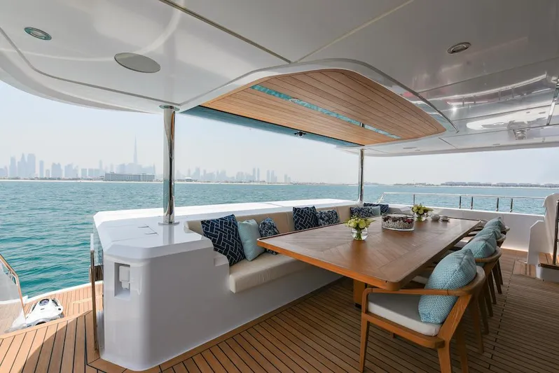  Yacht Photos Pics Luxurious 2026 Majesty 120 yacht deck with elegant seating and ocean view.