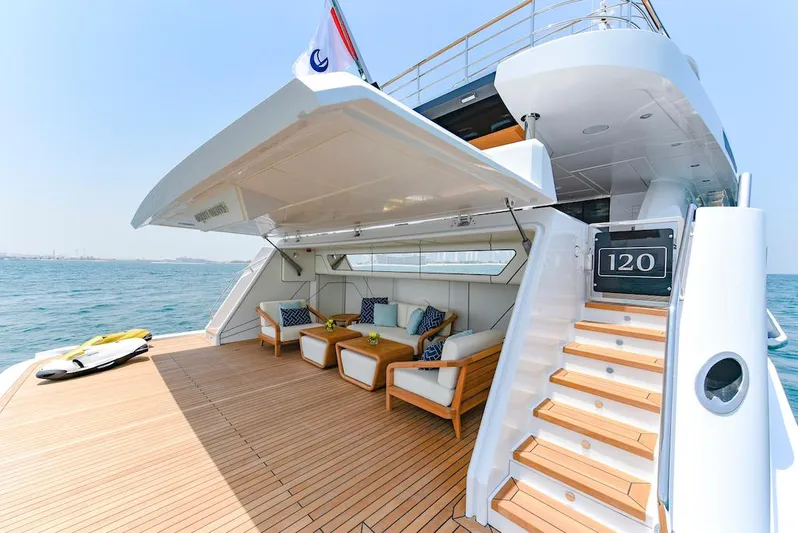  Yacht Photos Pics Luxurious 2026 Majesty 120 yacht deck with seating area and ocean view.
