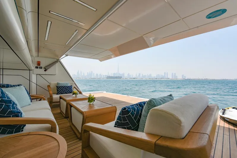  Yacht Photos Pics Luxurious 2026 Majesty 120 yacht deck with city skyline view.