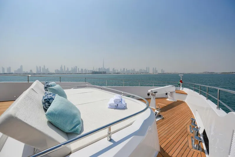  Yacht Photos Pics Luxurious 2026 Majesty 120 yacht deck with city skyline view.
