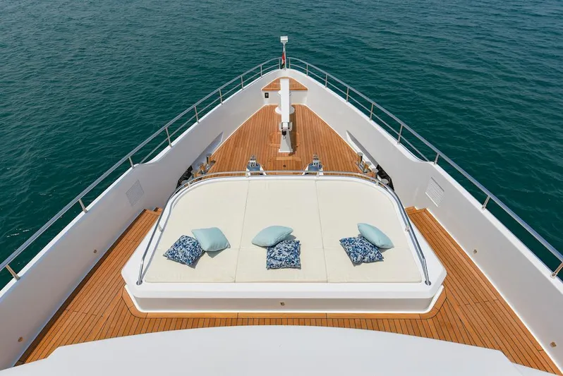  Yacht Photos Pics Luxury Majesty 120 yacht deck with cushions, 2026 model, on calm ocean waters.