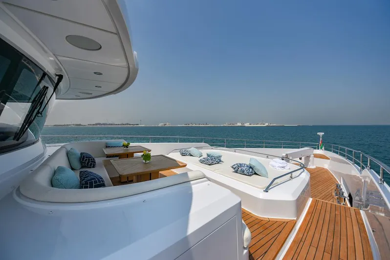  Yacht Photos Pics Luxurious 2026 Majesty 120 yacht deck with elegant seating and ocean view.