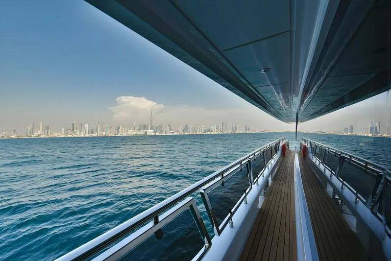  Yacht Photos Pics Luxury yacht Majesty 120 cruising with city skyline view, 2026 model.