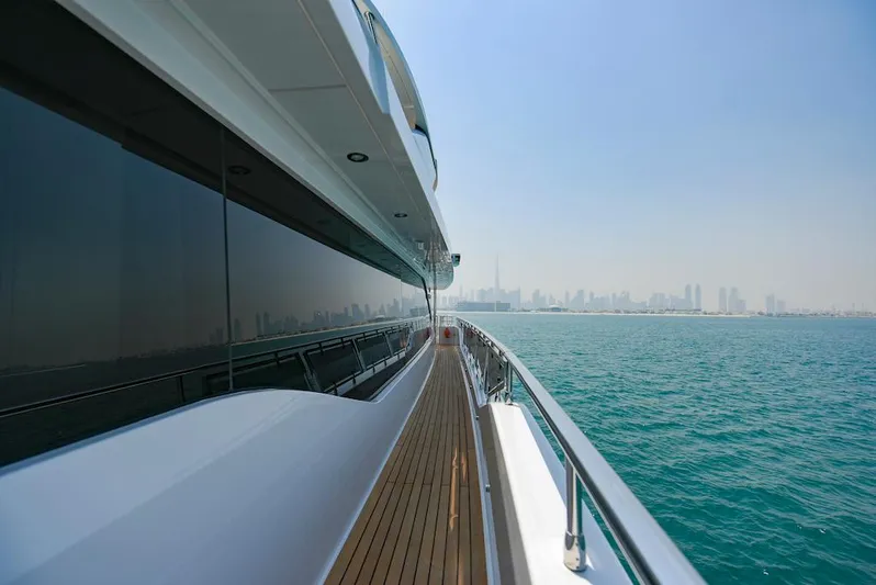  Yacht Photos Pics Luxury Majesty 120 yacht cruising with city skyline in the background, 2026 model.