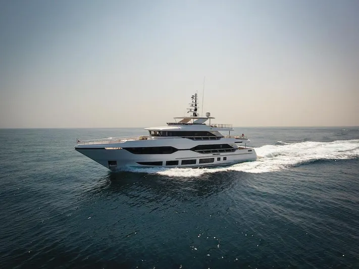  Yacht Photos Pics Luxurious 2026 Majesty 120 yacht cruising on open sea under clear sky.