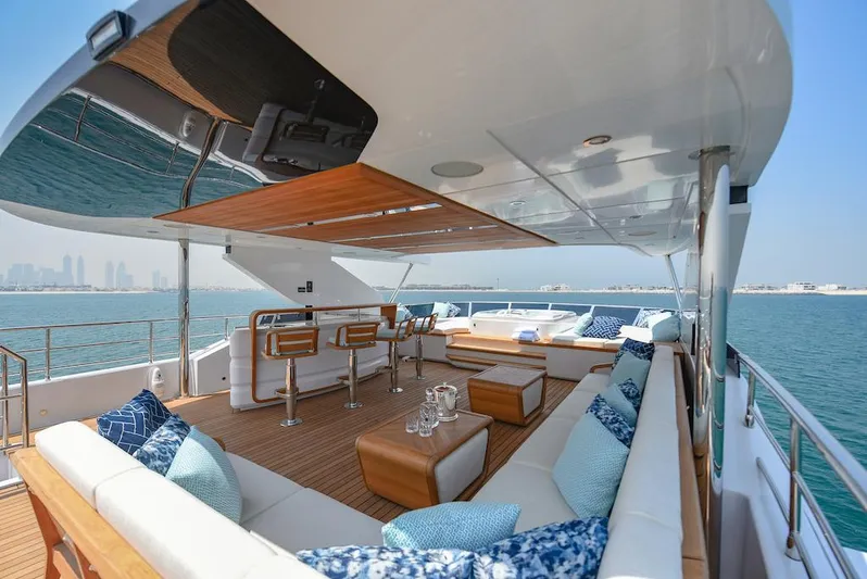  Yacht Photos Pics Luxurious 2026 Majesty 120 yacht deck with elegant seating and ocean view.
