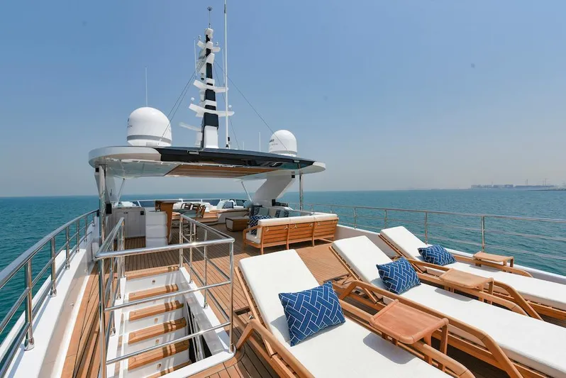  Yacht Photos Pics Luxurious 2026 Majesty 120 yacht deck with sun loungers and ocean view.
