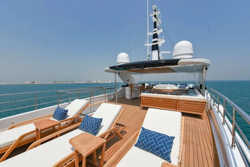  Yacht Photos Pics Luxurious 2026 Majesty 120 yacht deck with sun loungers and ocean view.