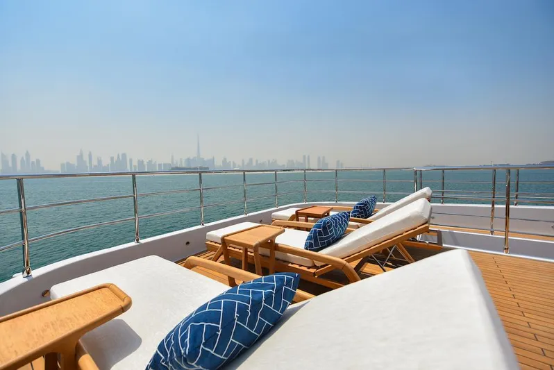  Yacht Photos Pics Luxurious 2026 Majesty 120 yacht deck with sun loungers and ocean view.