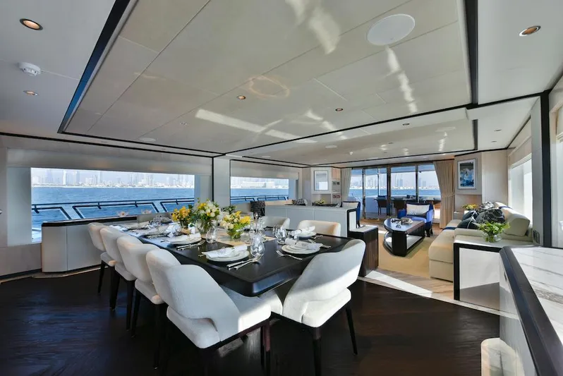  Yacht Photos Pics Luxurious interior of 2026 Majesty 120 yacht with elegant dining and seating areas.