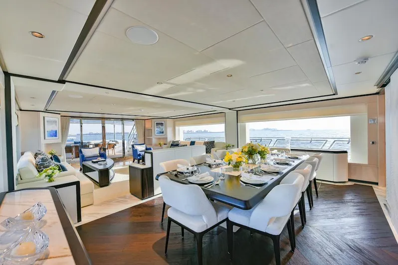  Yacht Photos Pics Luxurious interior of 2026 Majesty 120 yacht with elegant dining area and ocean view.