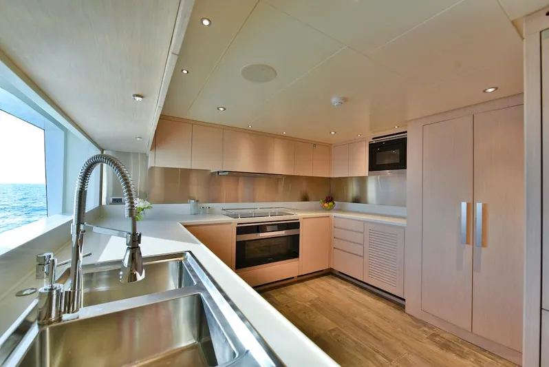  Yacht Photos Pics Modern kitchen interior on 2026 Majesty 120 yacht, featuring sleek design and ocean view.