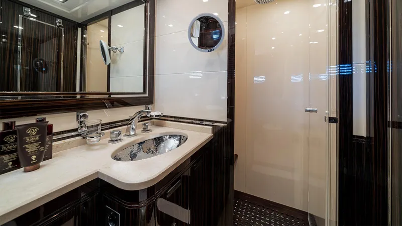 Deva I Yacht Photos Pics Luxurious bathroom interior of 2008 Mangusta 92 yacht with elegant fixtures and modern design.