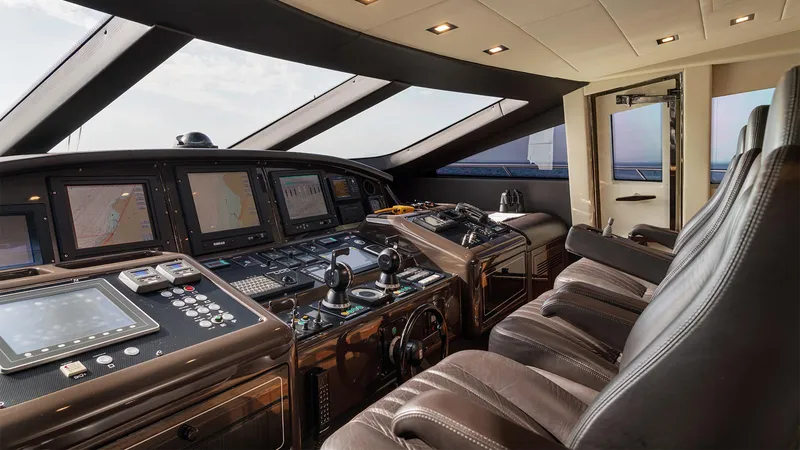 Deva I Yacht Photos Pics Luxurious 2008 Mangusta 92 yacht cockpit with advanced navigation systems and leather seating.