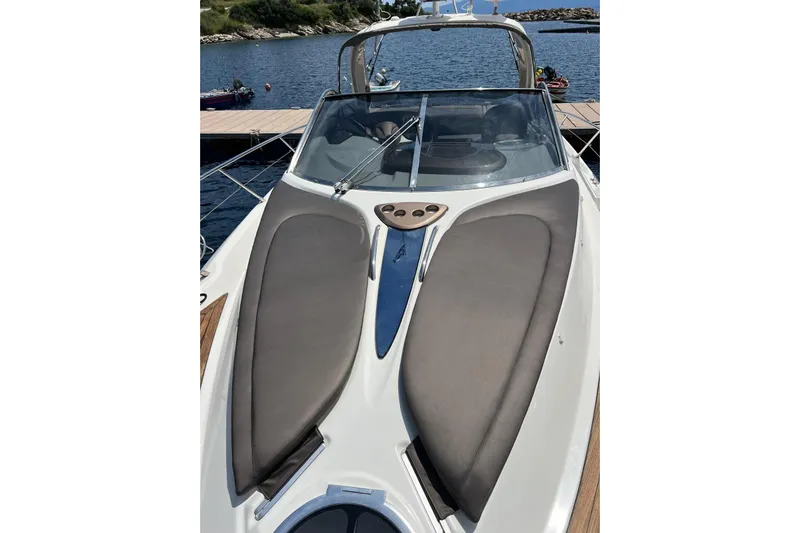  Yacht Photos Pics 2009 Crachi Endurance 33 boat docked, featuring sleek design and comfortable seating.