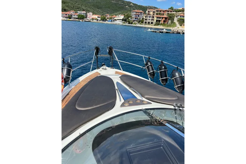  Yacht Photos Pics Bow view of 2009 Crachi Endurance 33 yacht in scenic coastal waters.