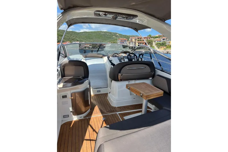  Yacht Photos Pics 2009 Crachi Endurance 33 boat interior with wooden deck and seating area.